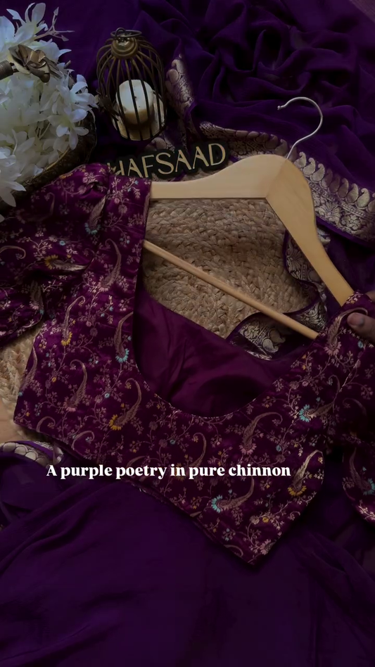 A pure chinnon purple jacquard and embroidery saree is a stunning choice for traditional and festive occasions